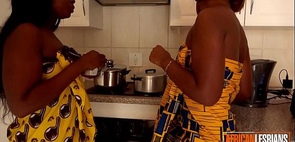  Two black amateur lesbians get naughty in the kitchen